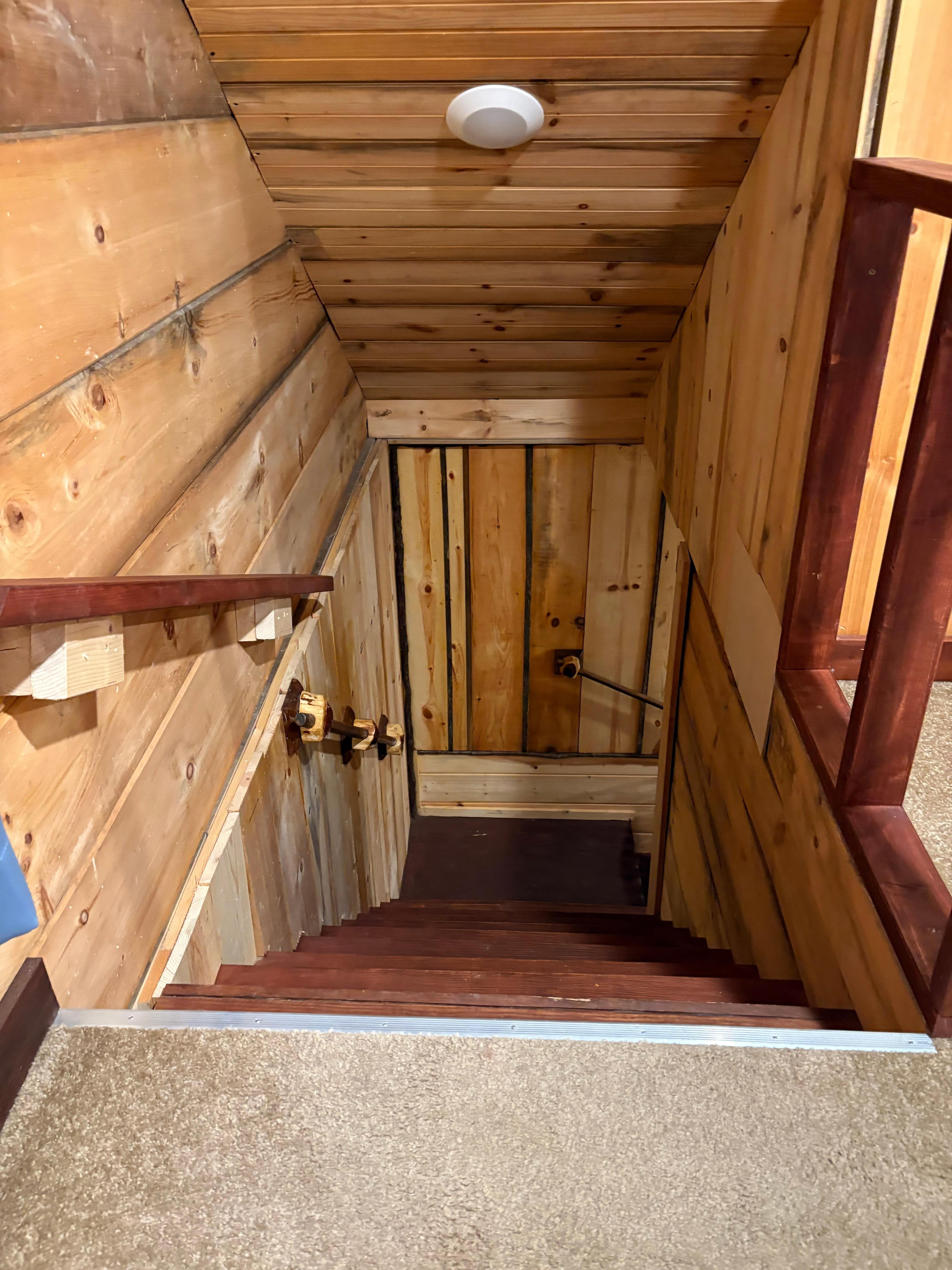 Death trap stairs with railing that isn’t up to code. 