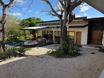 View of the patio/kitchen/living room from the bedrooms