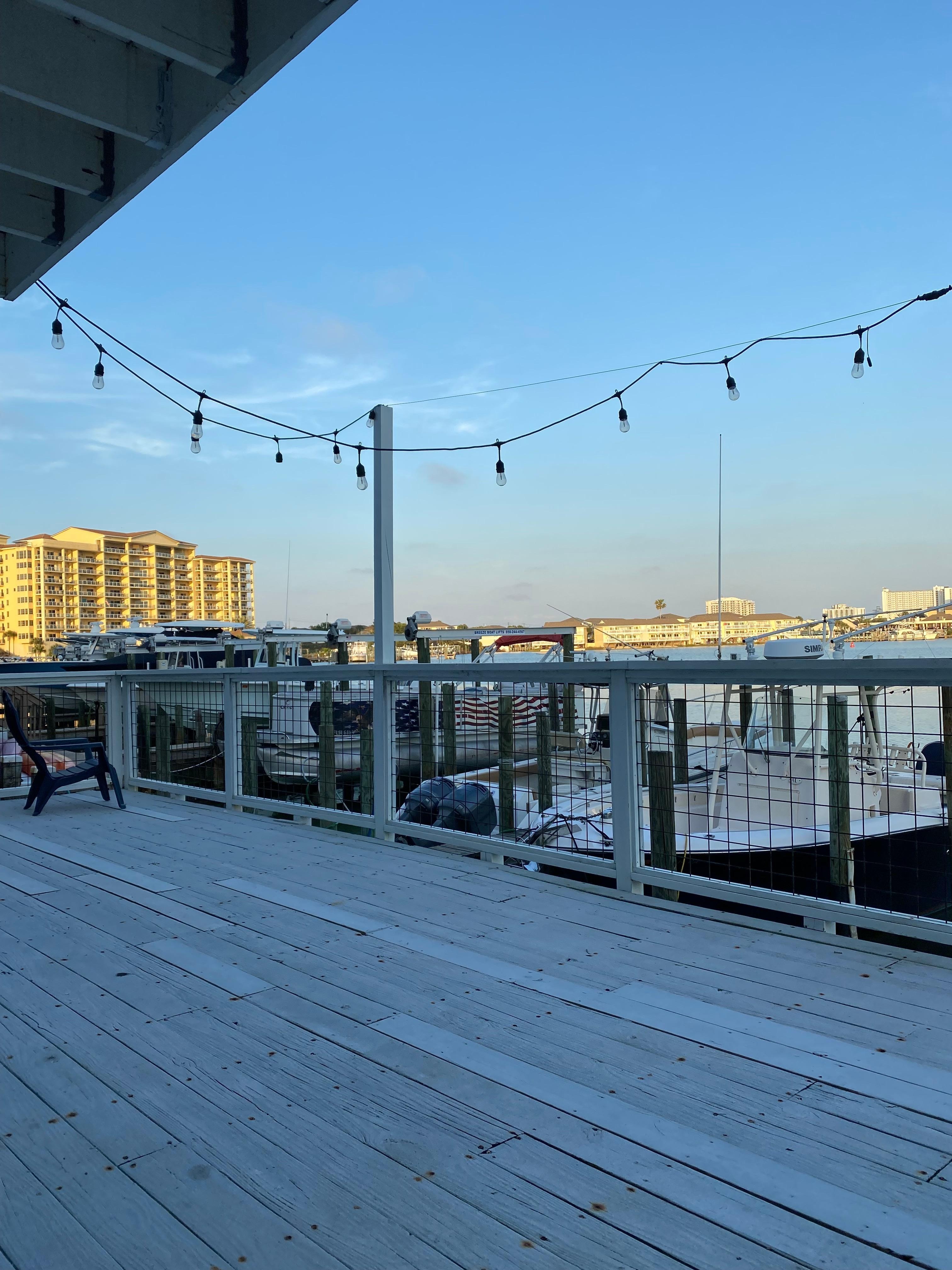 View behind the condo building property with a deck on the marina!