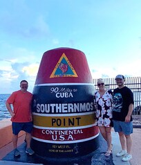 Obligatory photo with our son at Southernmost Point.