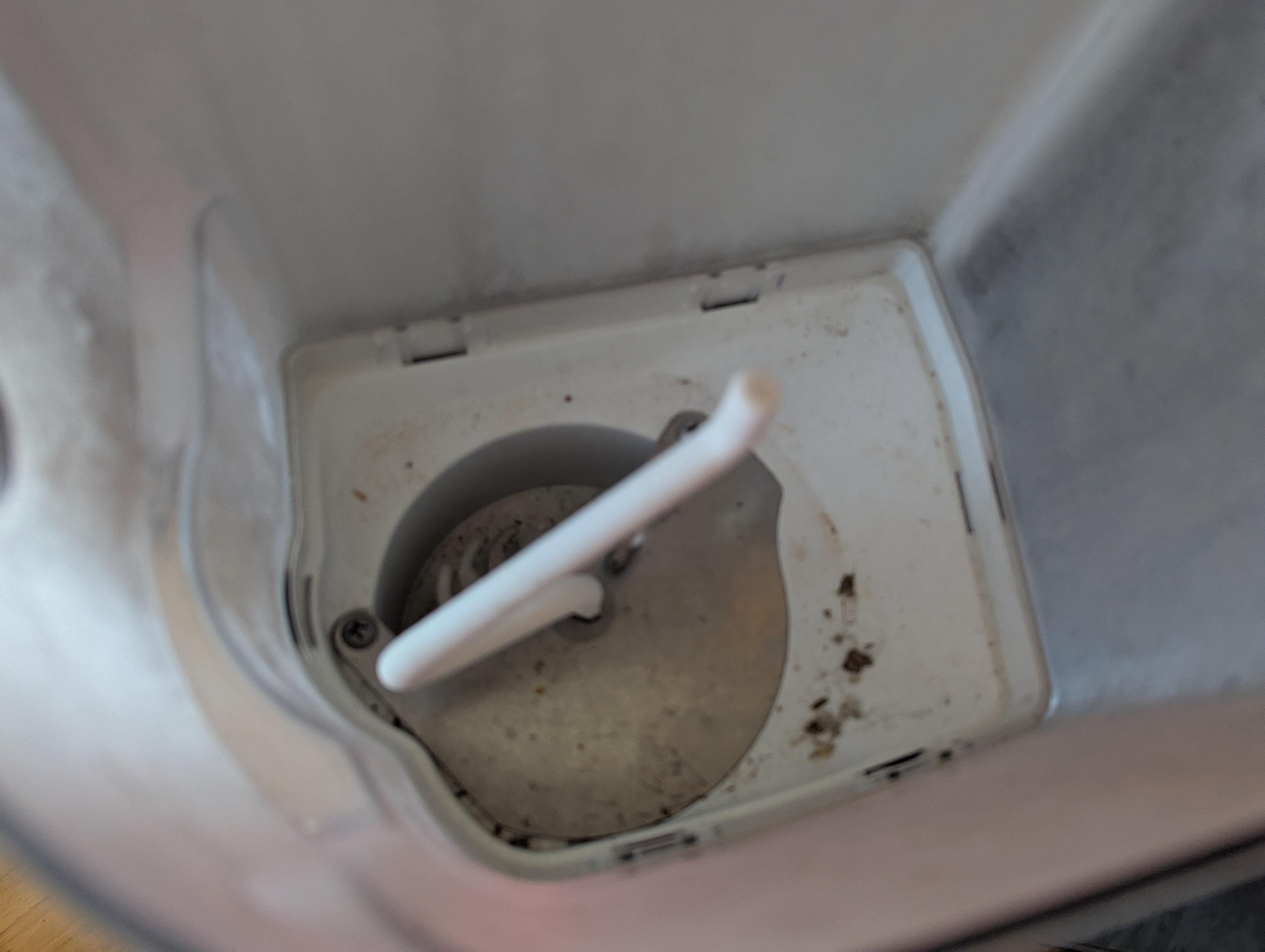 Ice maker in freezer.  Does not operate, covered in mold so probably a good thing it is broken..