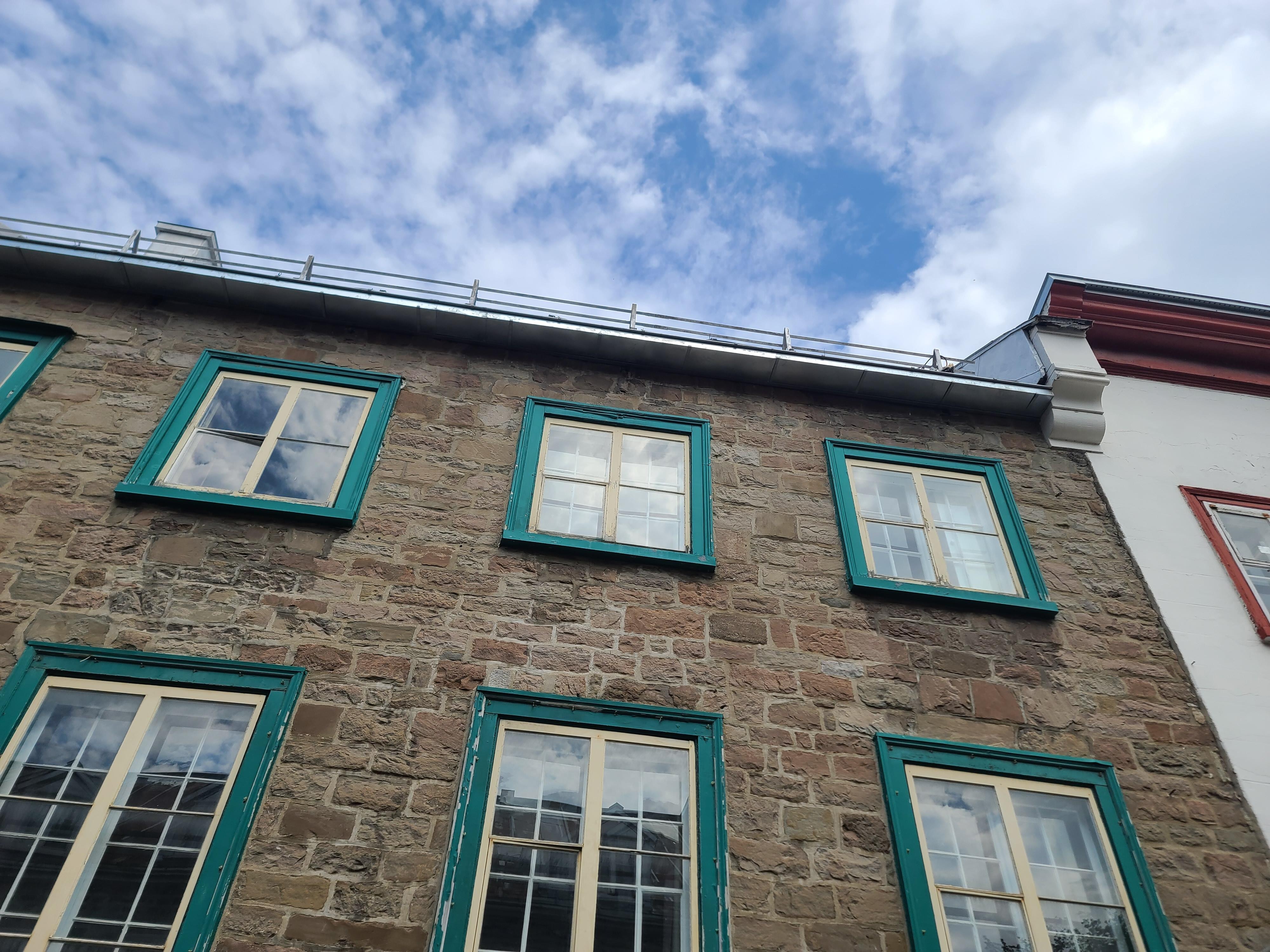 This is the building with green window frames