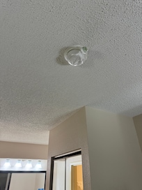 Smoke alarm covered in a plastic bag