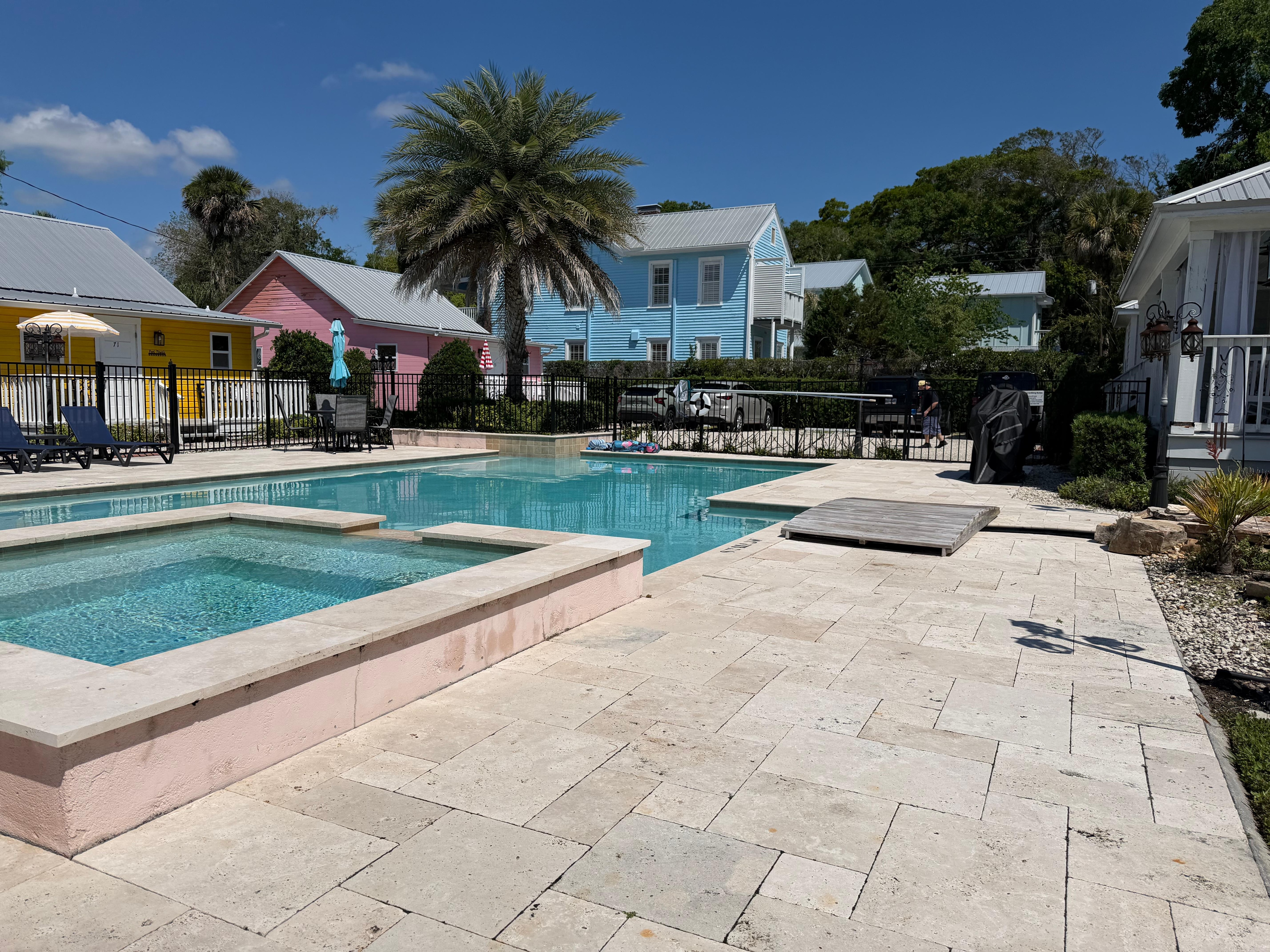 Hot tub & pool with cottages in background