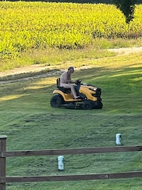 Nudest neighbor to the west mowing.