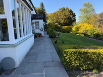 Front of the property as viewed from the side, and entrance way to the B&B