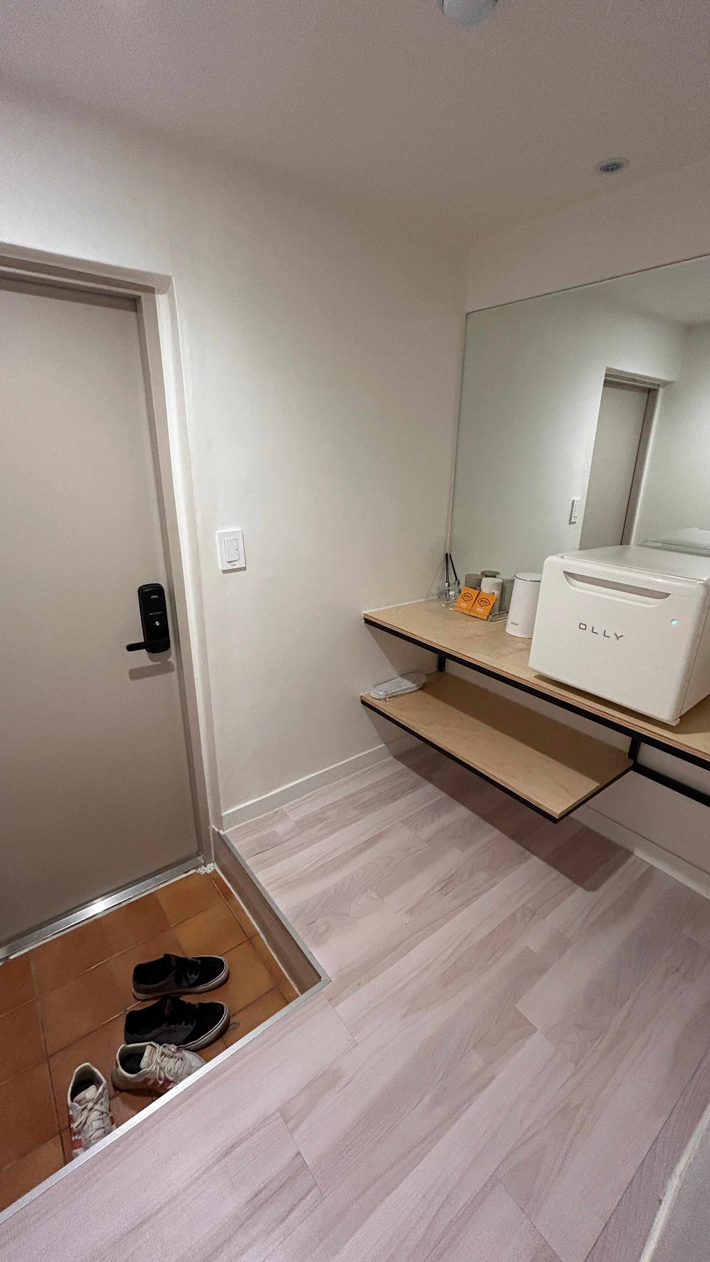 Entry way with fridge full of water bottles during our stay. 
