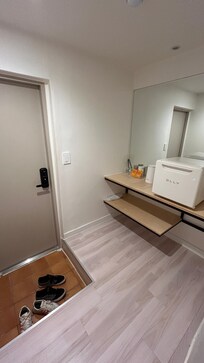 Entry way with fridge full of water bottles during our stay.