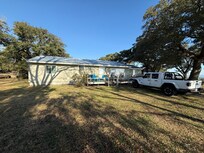 Outside of the house.