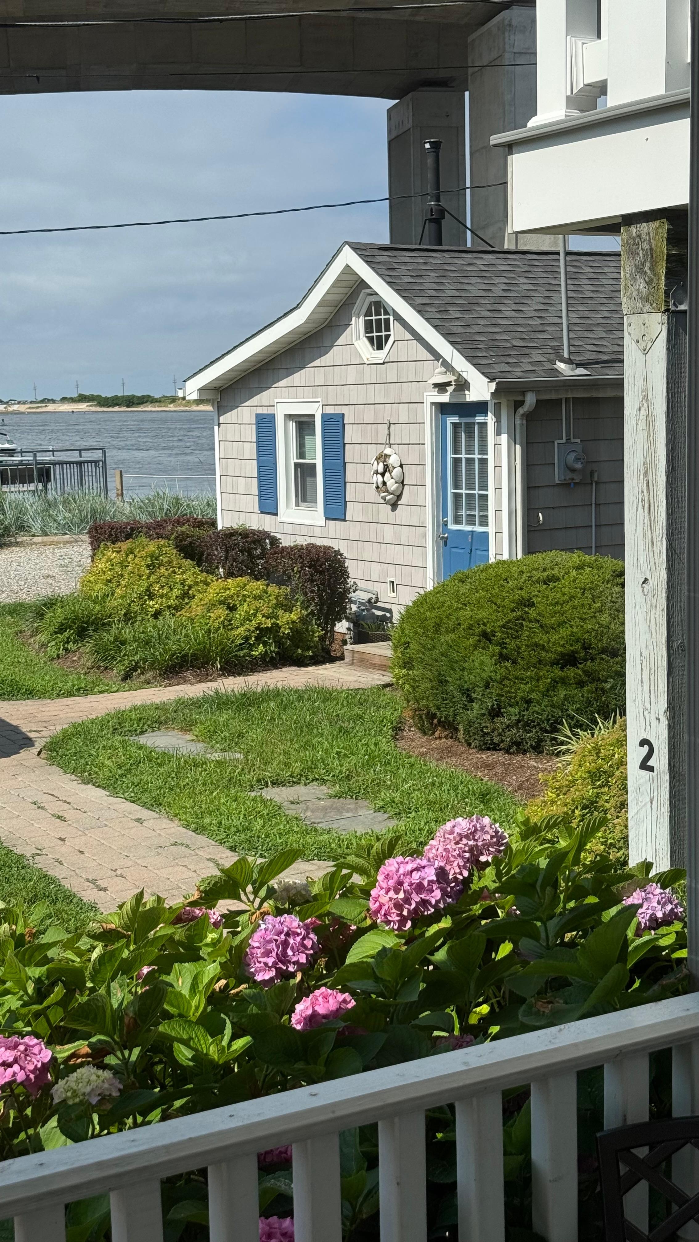 One of the adjacent buildings and the view from the front of our house. 