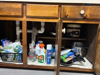 Kitchen cupboard under the sink.