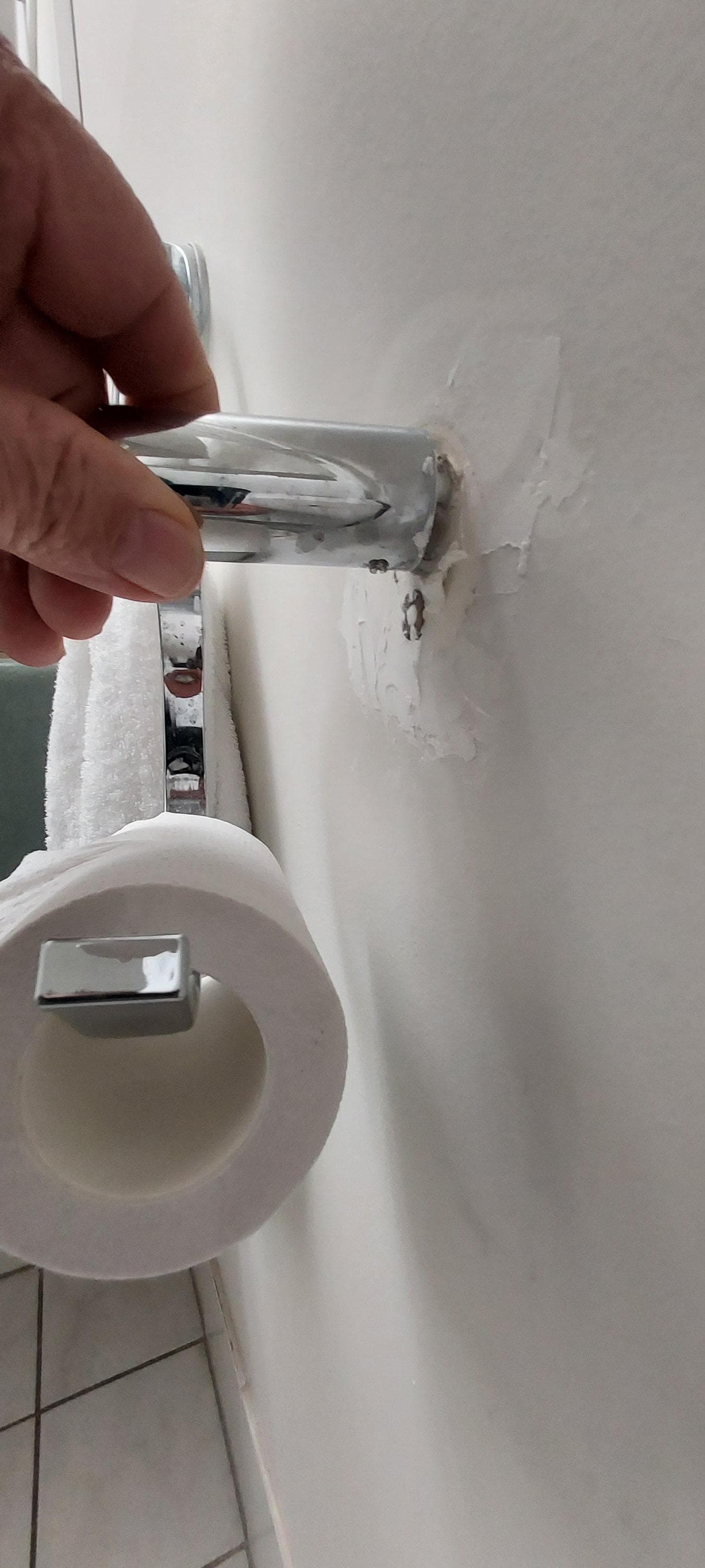The broken toilet roll holder