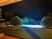 View of the pool from the covered dining area.