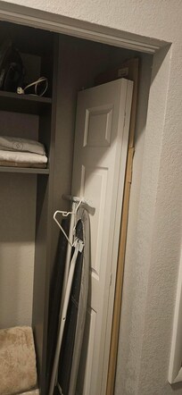 Closet door removed and placed in the closet.