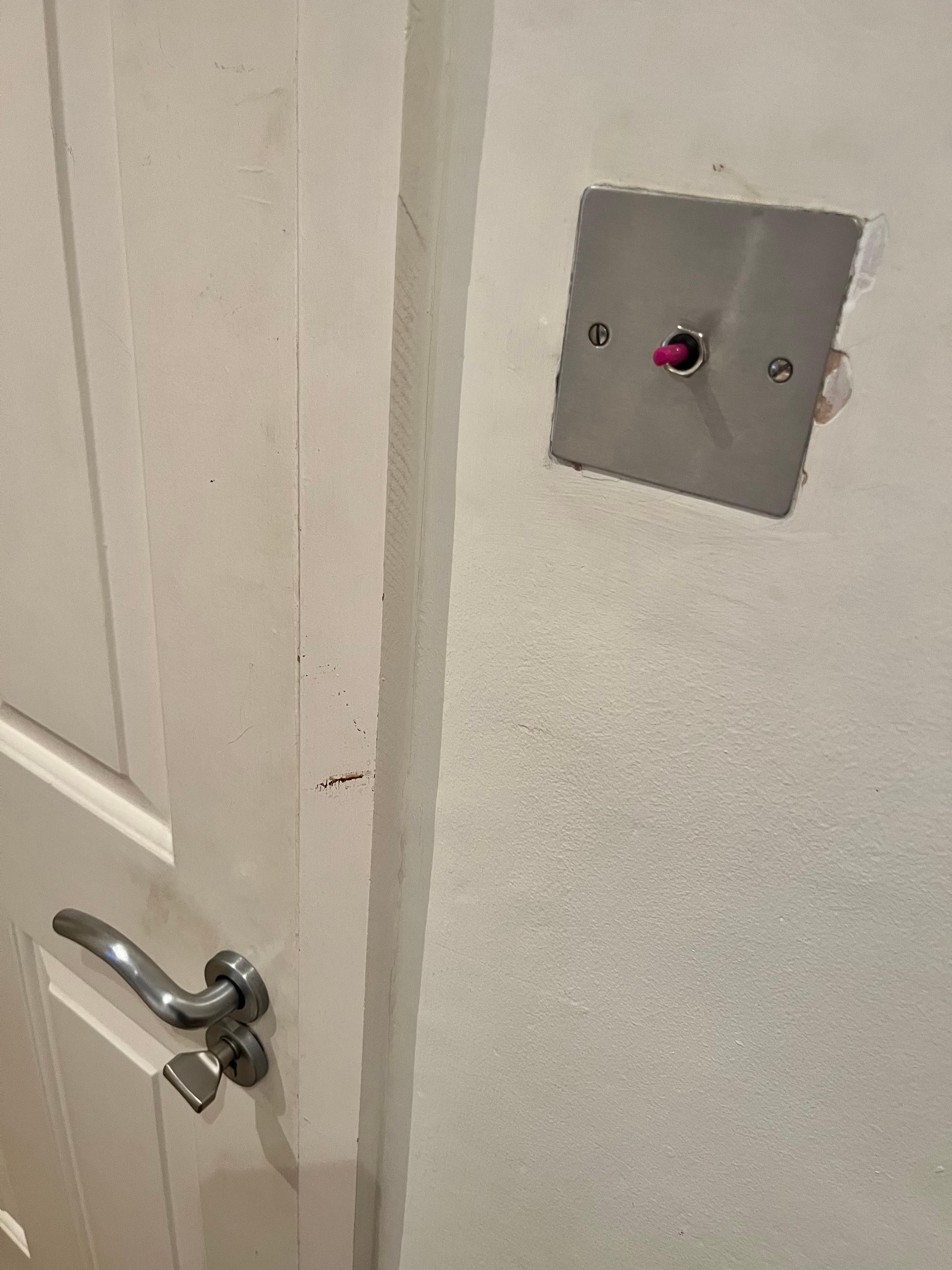 Filthy door and missing light switch 