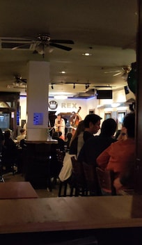 Photo from the bar looking at the band at a distance.