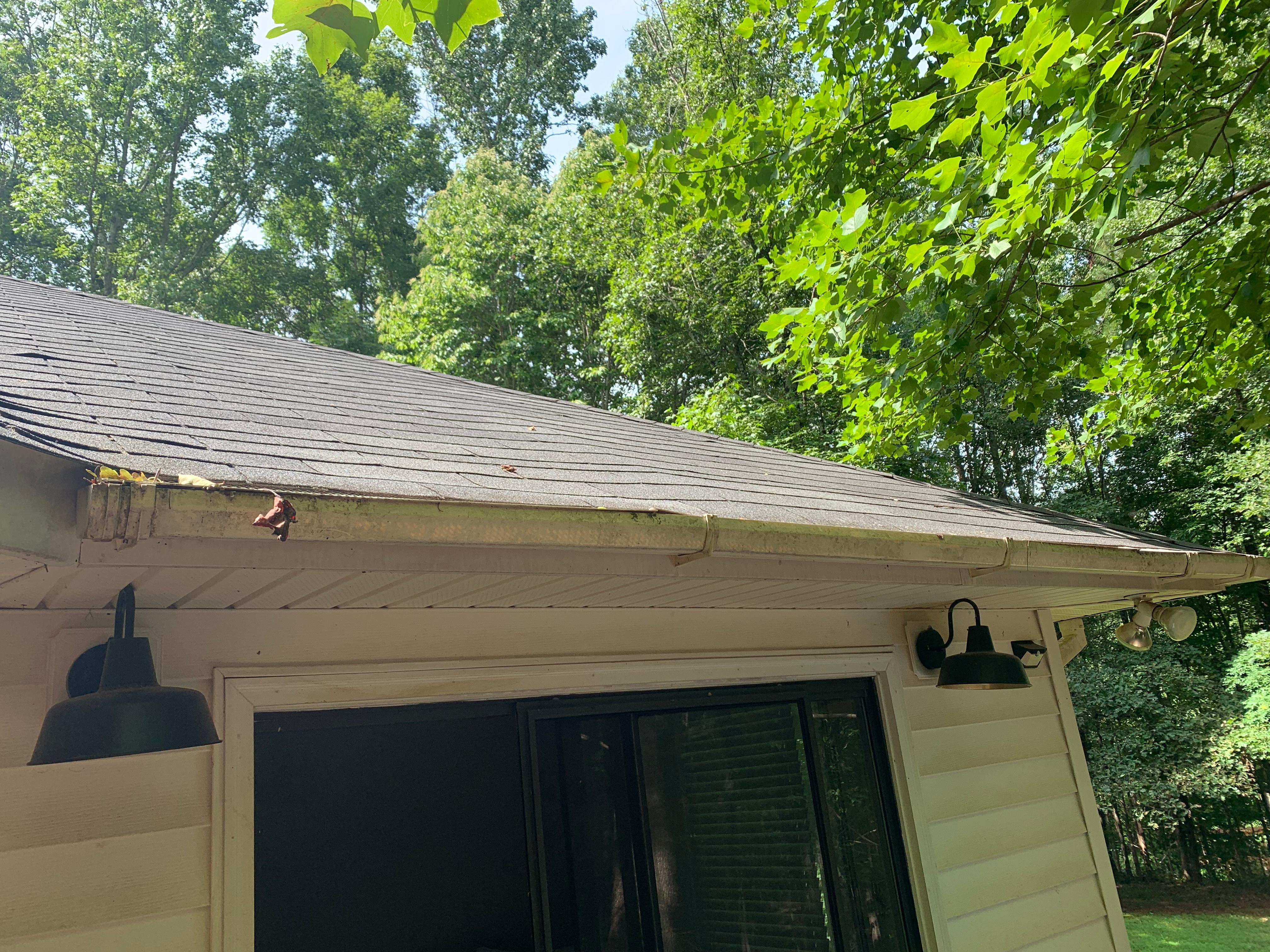 Back patio gutters filled completely deck unusable