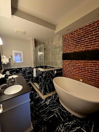 Very beautiful bathroom with large soaking tub and separate luxury shower.