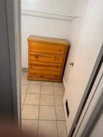 broken dresser in bathroom