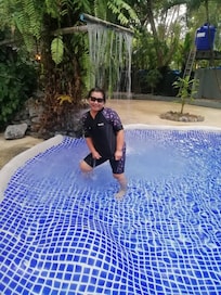 Happy little pool with water fall massage.
