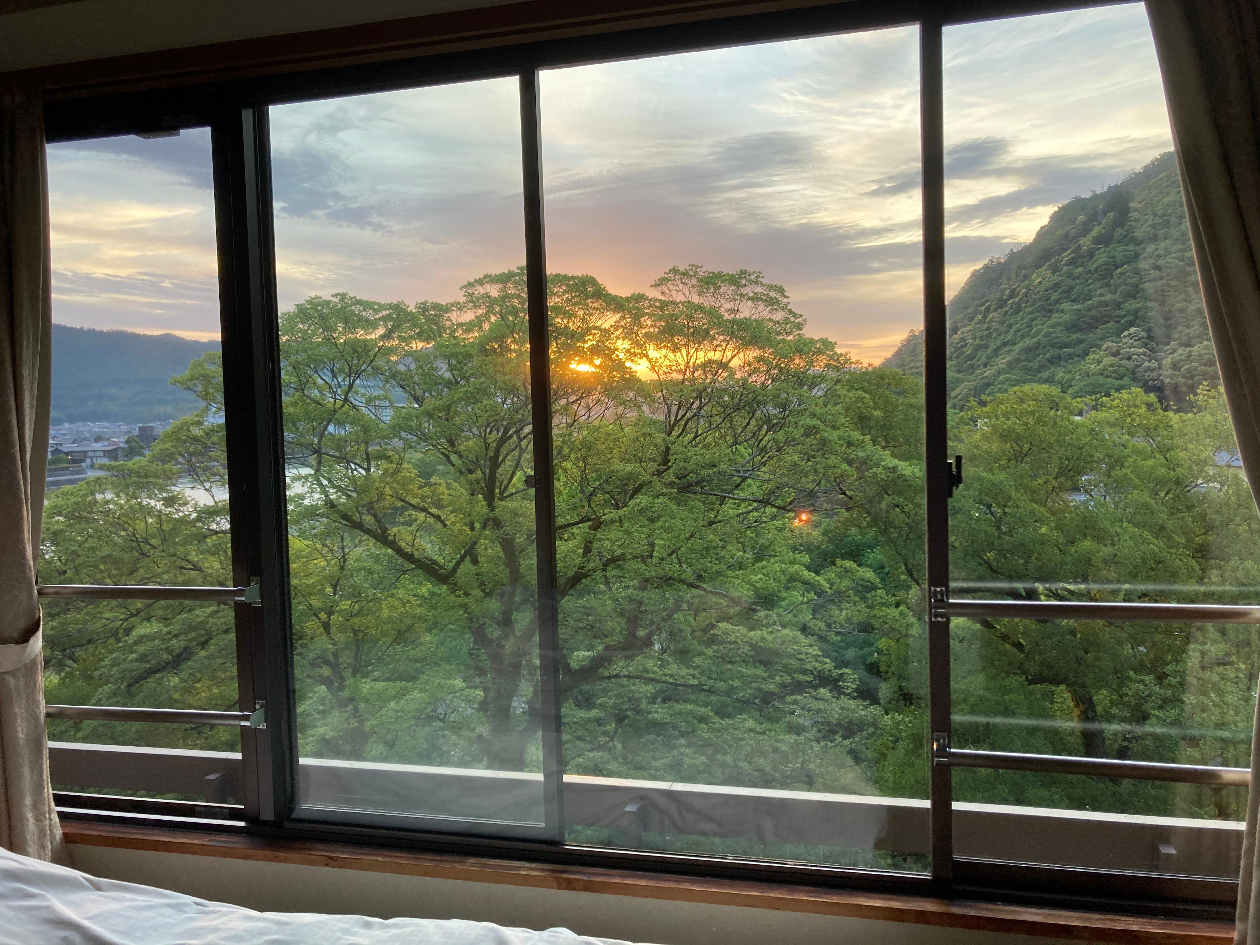 This was the view of daybreak from my room’s large window right alongside the beds.