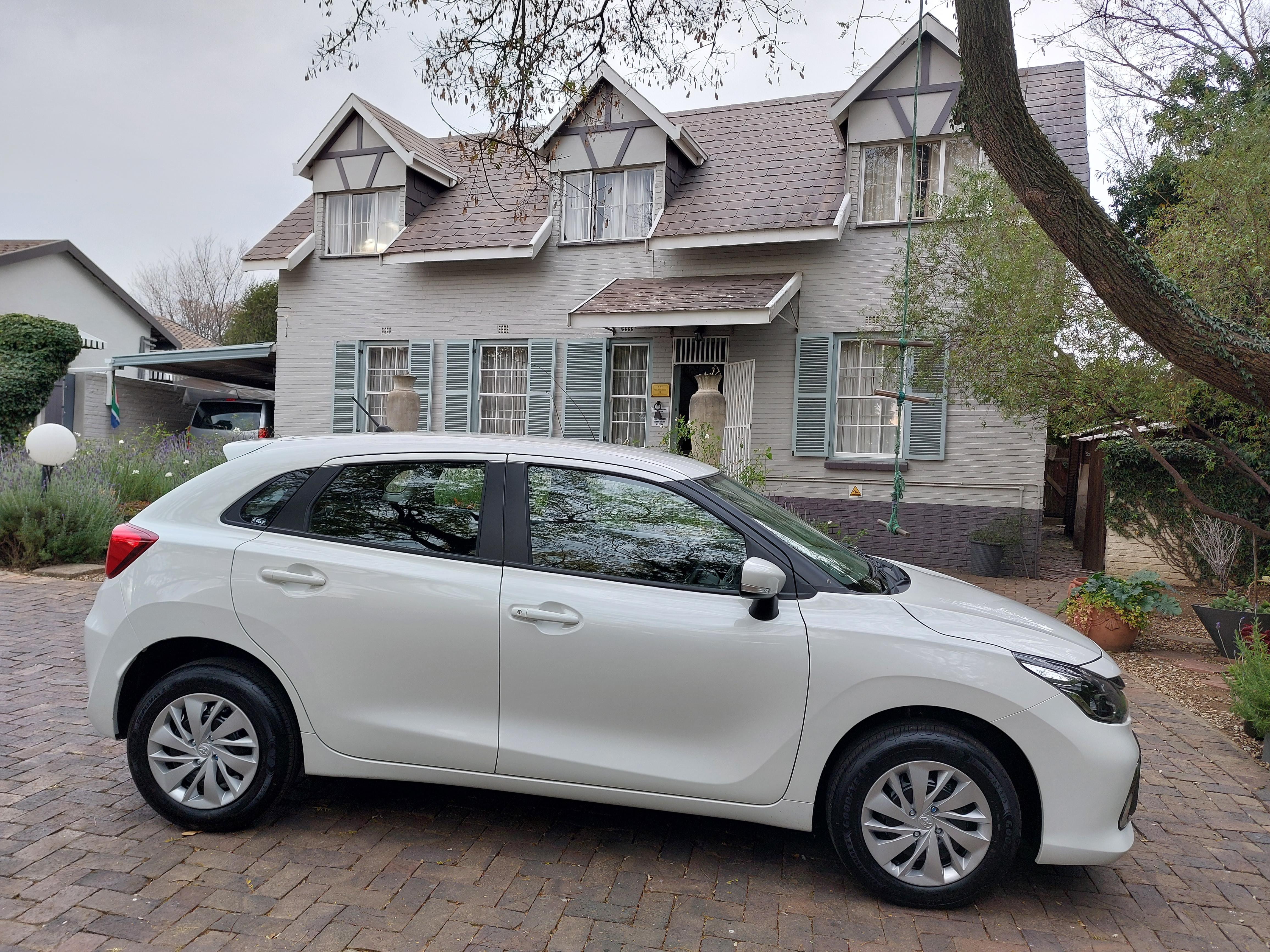 Our car in the parking area in front of the guest house.