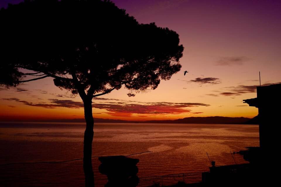 Sunset views at Camogli are beautiful, but don't limit yourselves to the beach and harbor. Go to Piazza Simone Schiaffino instead.