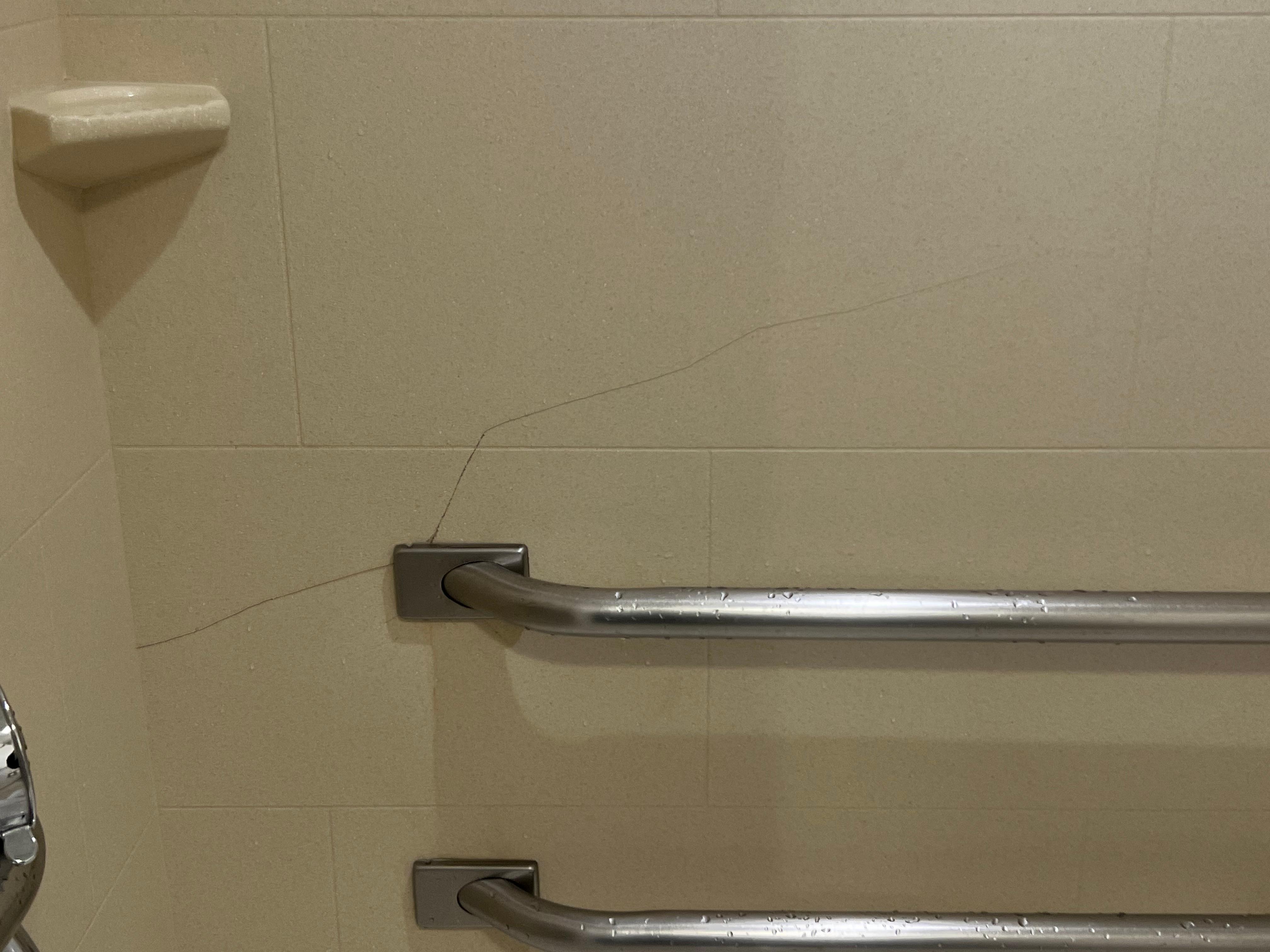 Giant crack in the shower and shower handle kept falling down 