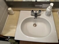 Bathroom with bug and some grime.
