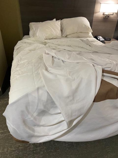 Bed sheets not replaced, both twin beds not dressed