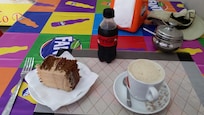 Cafe next door. Cake, cappuccino and coke 220 MZN.