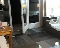 Door leading to Balcony.
Living room.
Dining table held a huge TV. TV could be Wall mounted...so more space to use table.