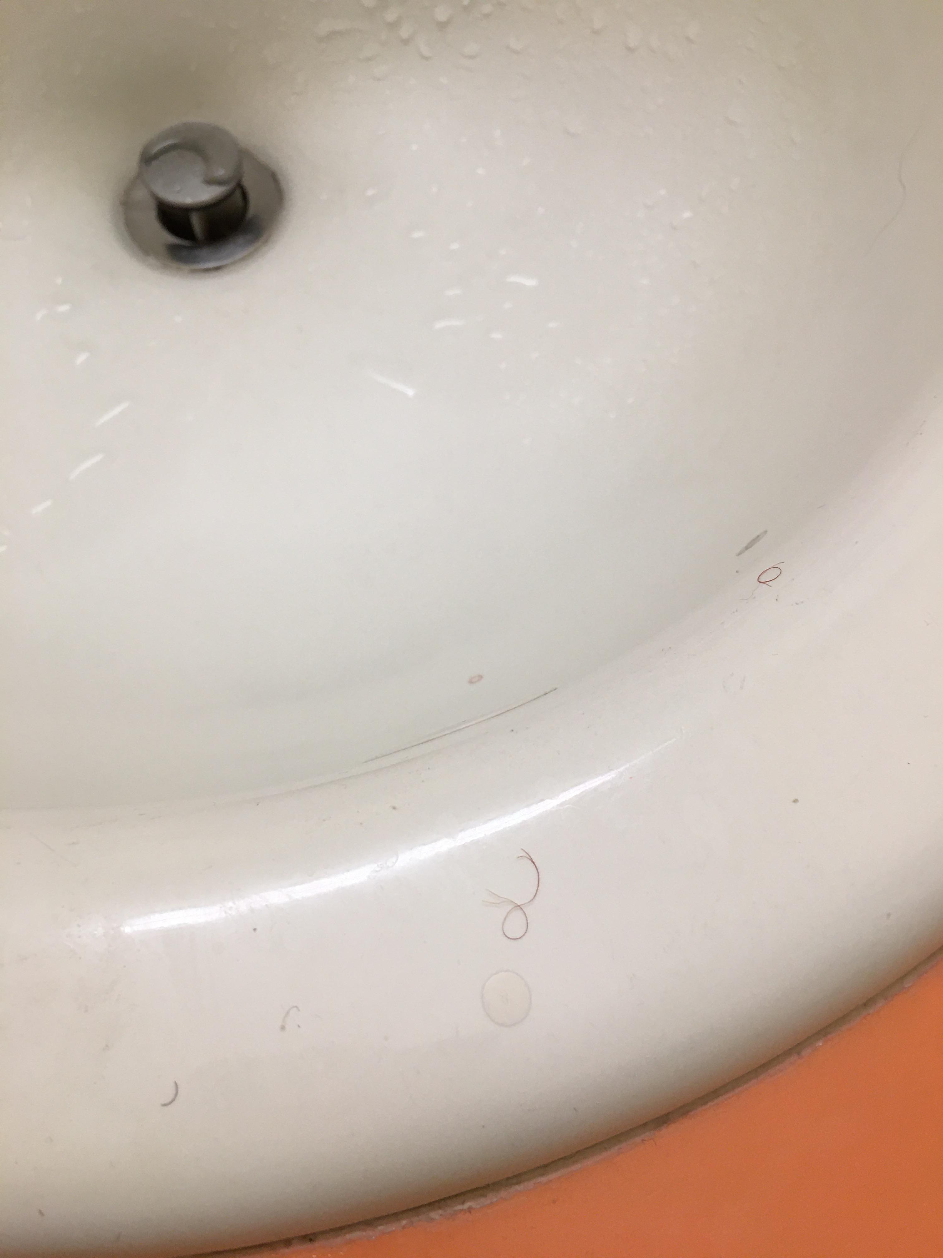 Curly hairs in and around sink