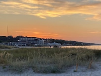 Sunset behind the hotel. View from the nearby harbour.