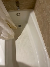 Tub looked dirty and needed a thorough cleaning.