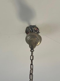 Light fitting above bed.