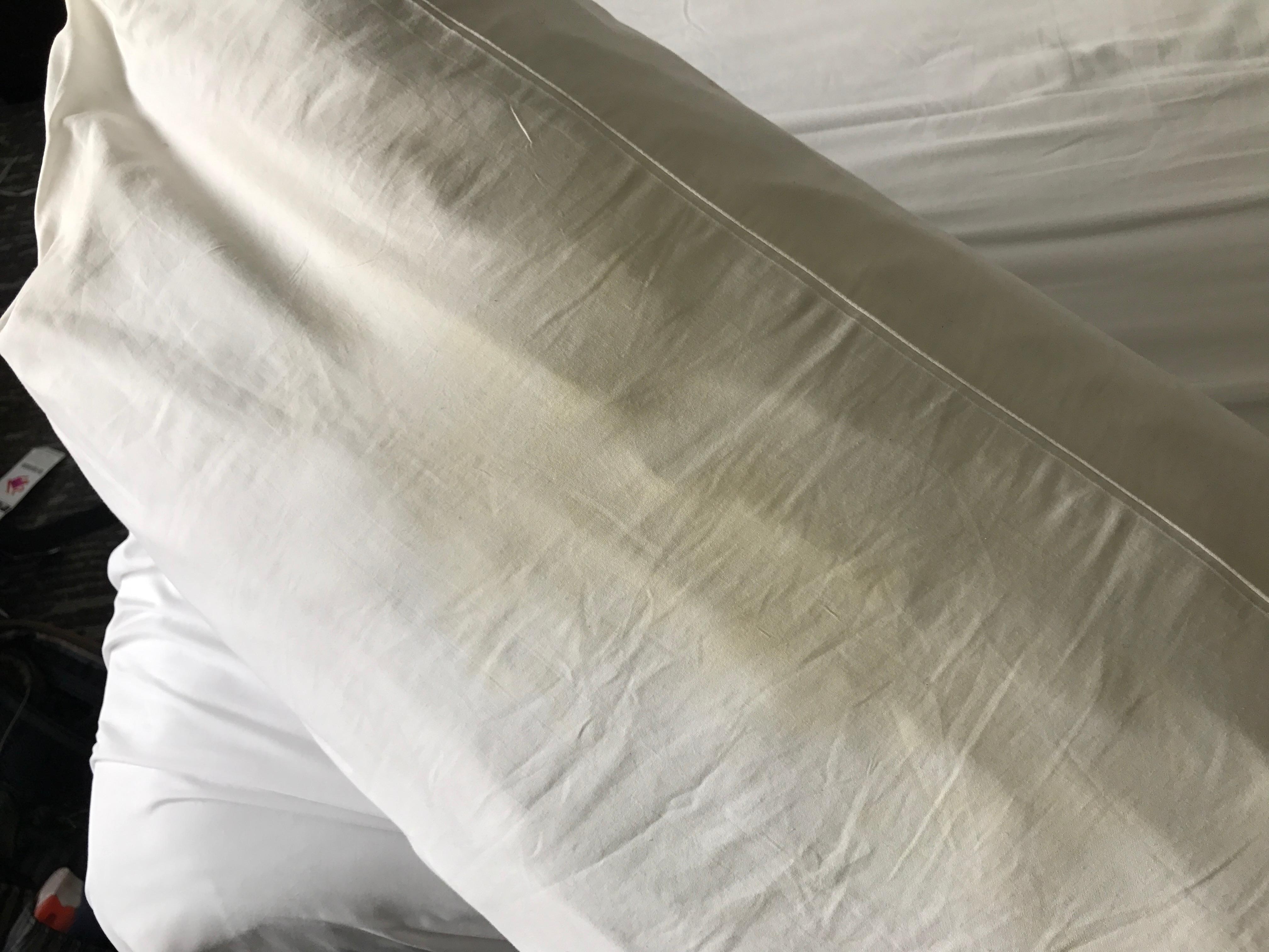 Pillow with yellow stains