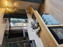 Facilities in bedroom. TV, mini bar, tea/coffee facilities.