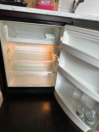 Damaged refrigerator:
Missing door to the freezer compartment, which causes the food there to melt