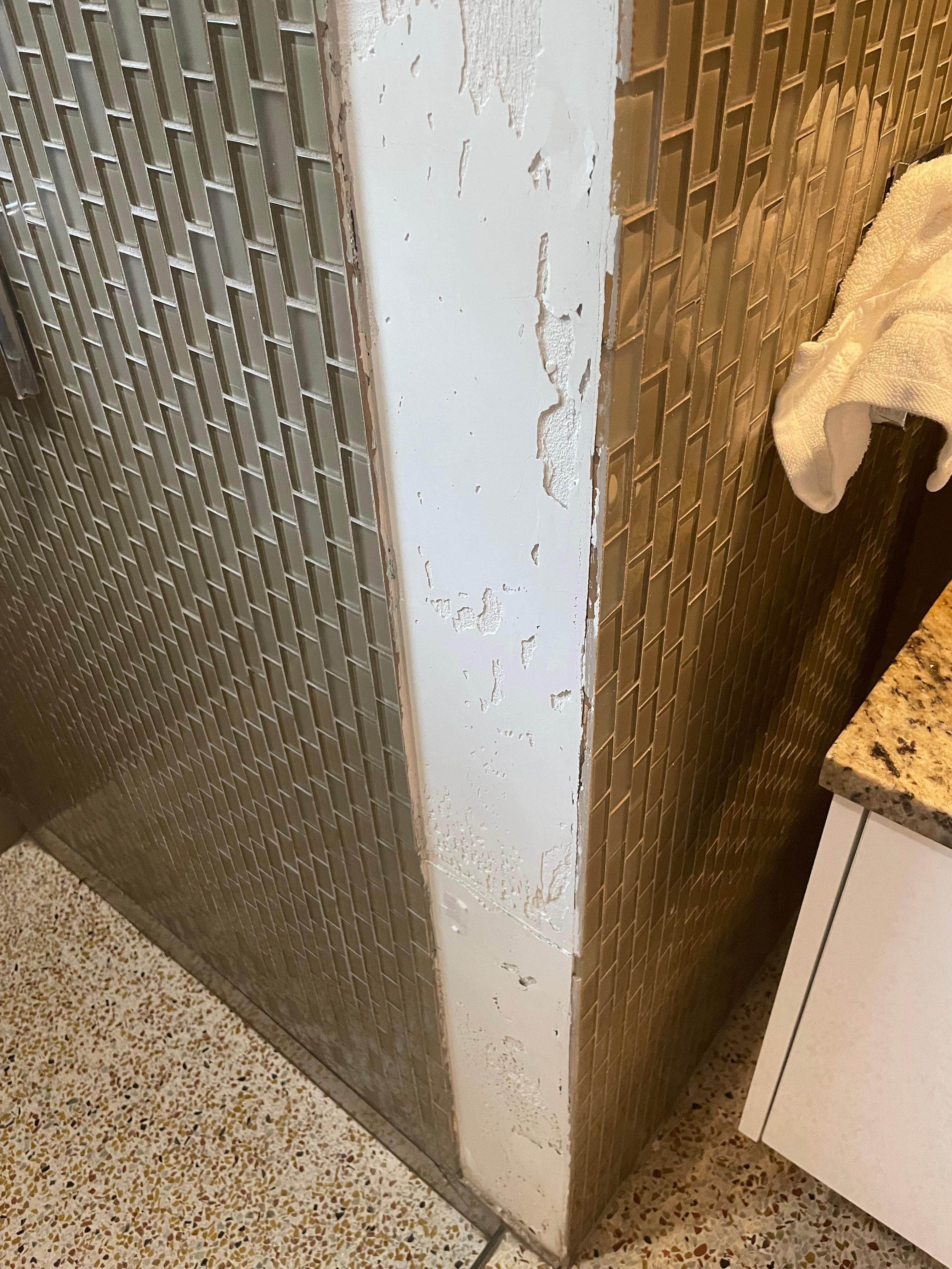 missing tiles in shower area, tiles held on with selotape