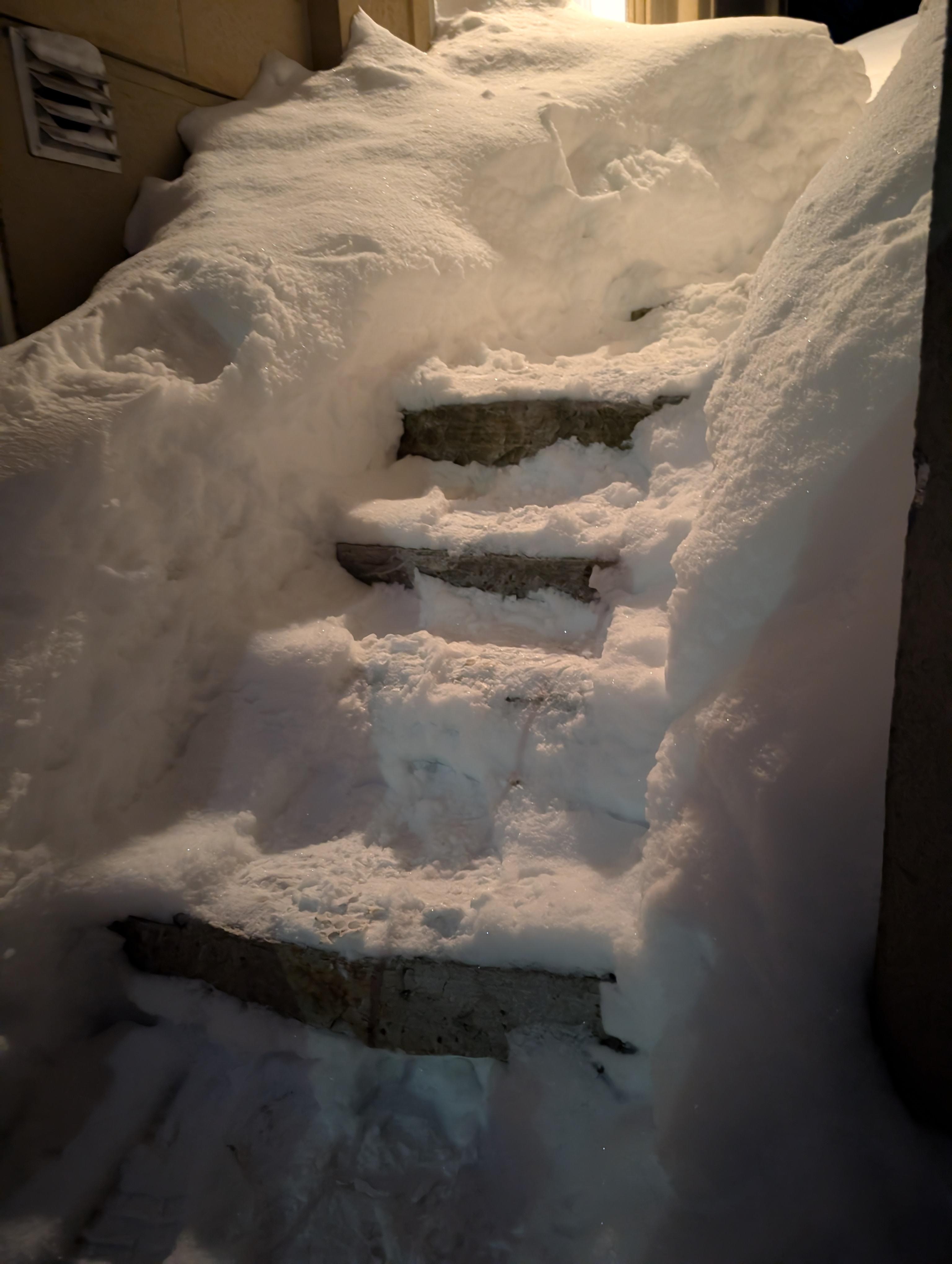 Steps to the door with coded entry