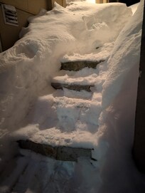 Steps to the door with coded entry