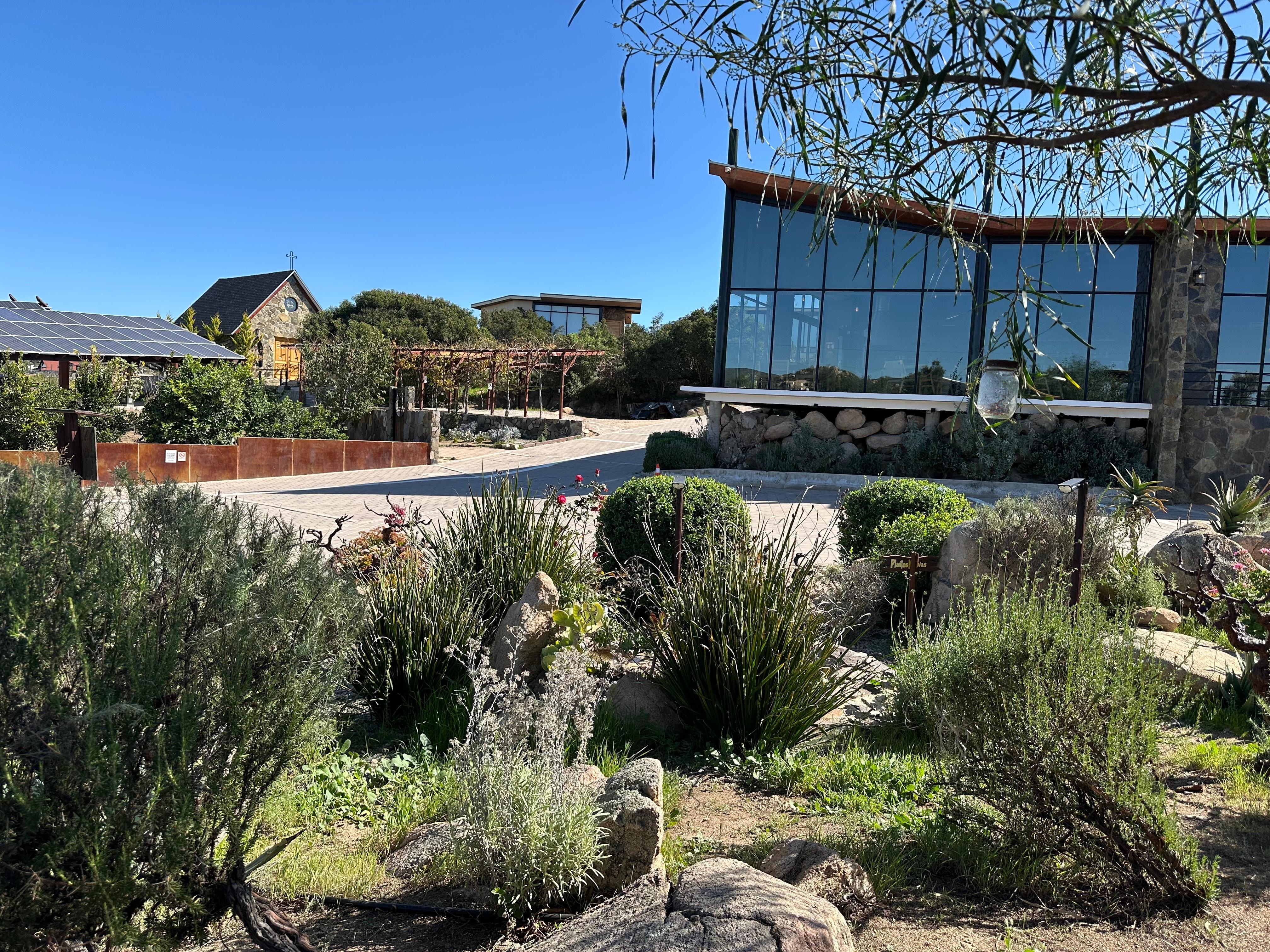 Property grounds with chapel and restaurant in the background