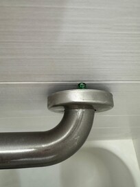 Bar pulled away from shower wall.