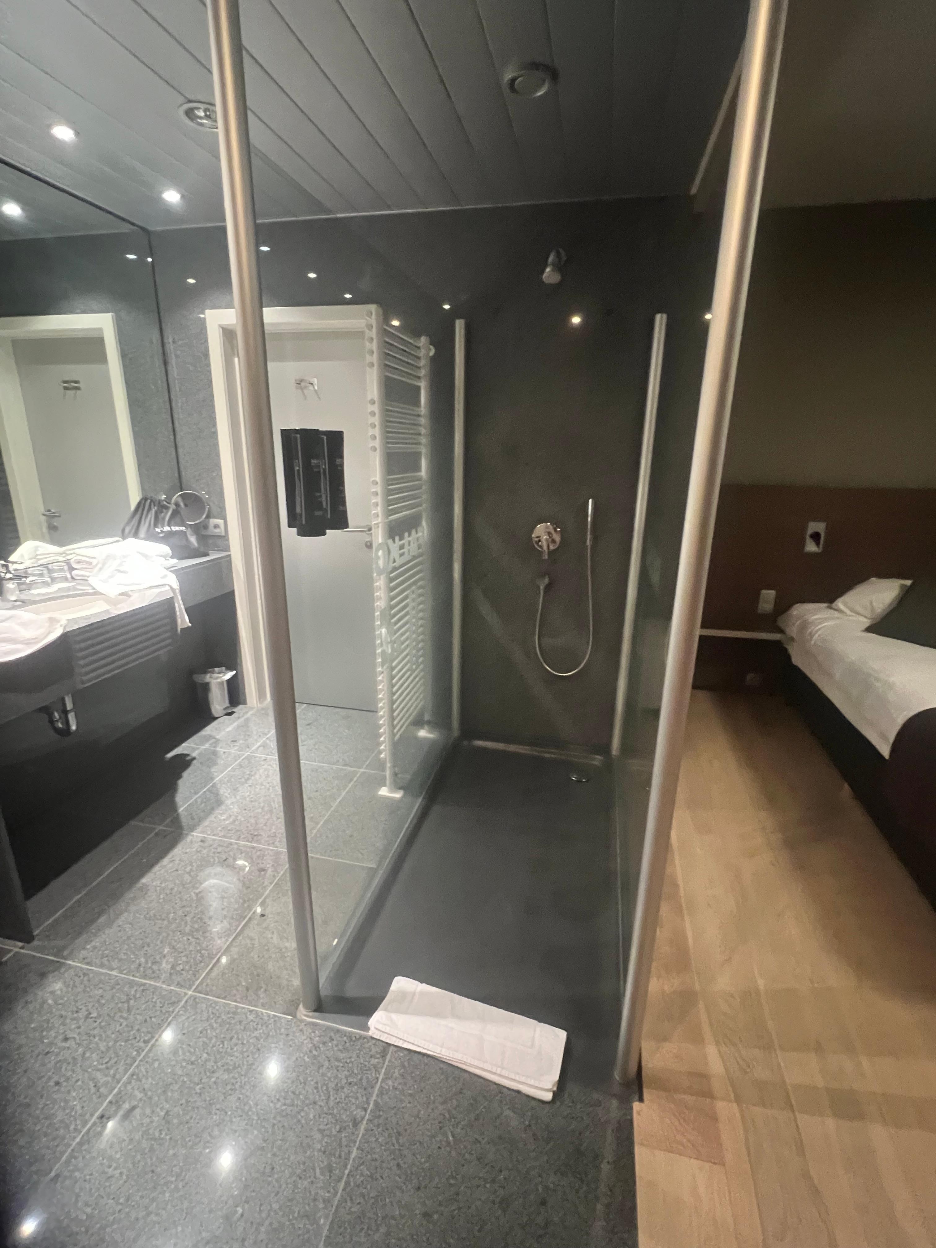 The glass shower in the middle of the room poses an issue if you have children in the room.
