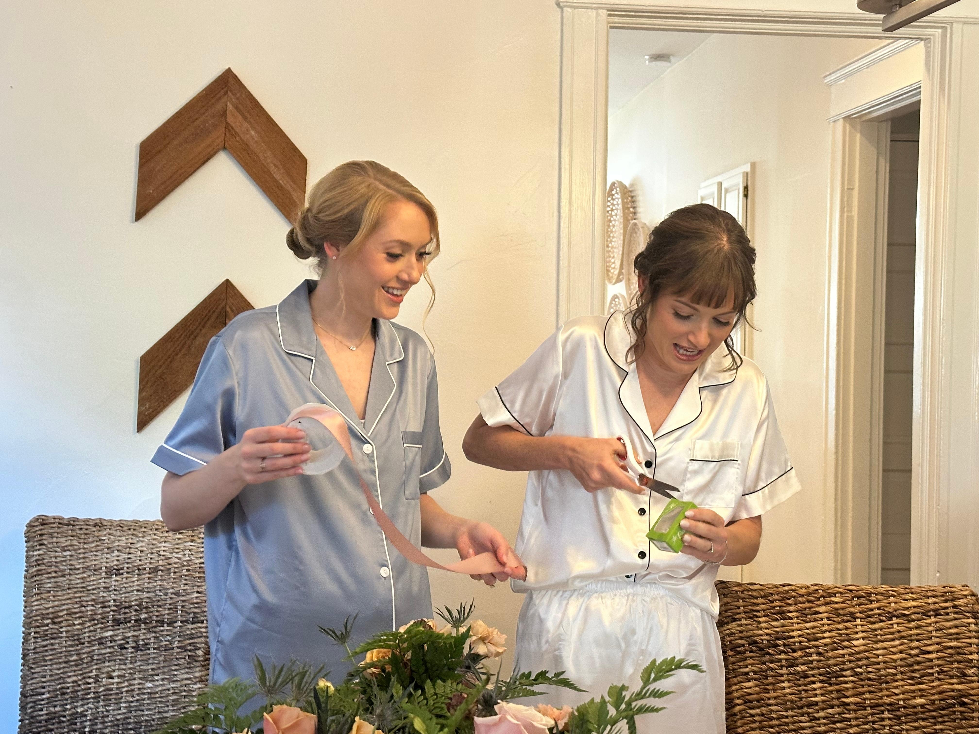 Putting final touches on the bouquets in the dining room. 