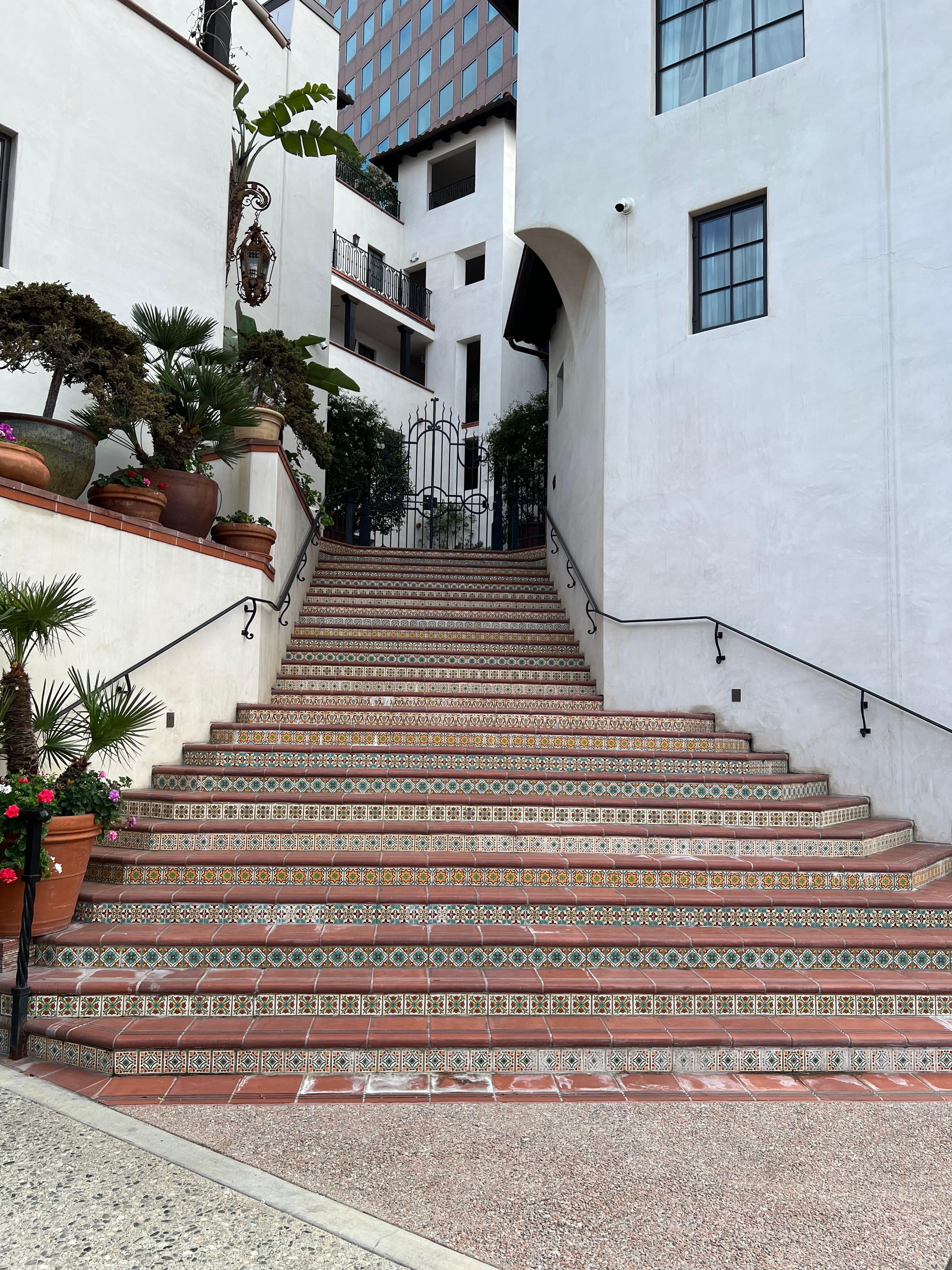 The stairway from the street to the second floor of Plaza la Reina.