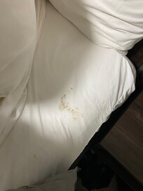 Stained by the top of the bed