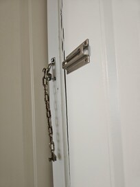 Front door latch in need of repair.