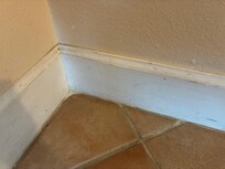 Scuffed walls and floorboards